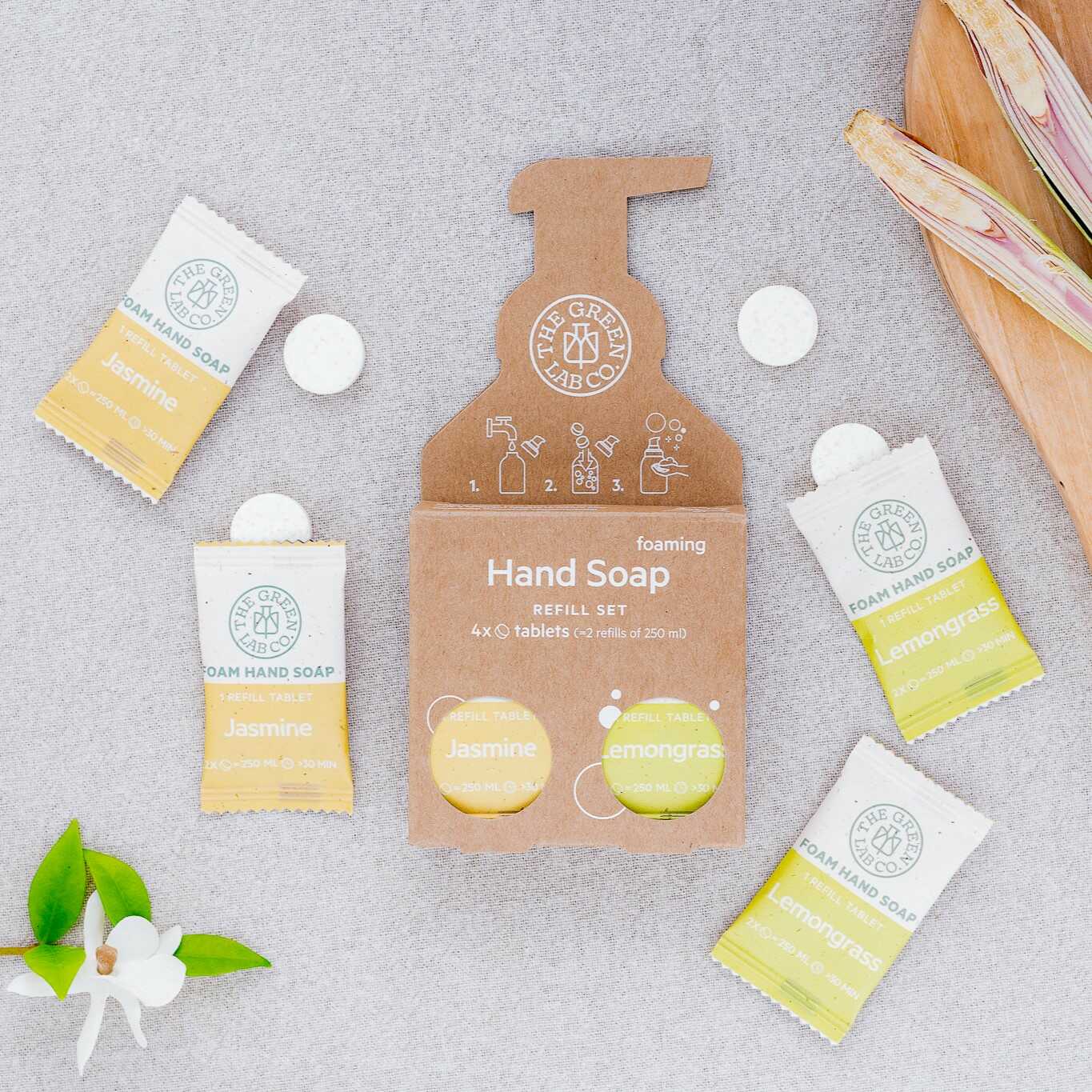 The Green Lab Co foaming hand soap refill set—Jasmine & Lemongrass tablets on a light fabric background.